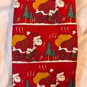 Red silk Santa riding a bike tie